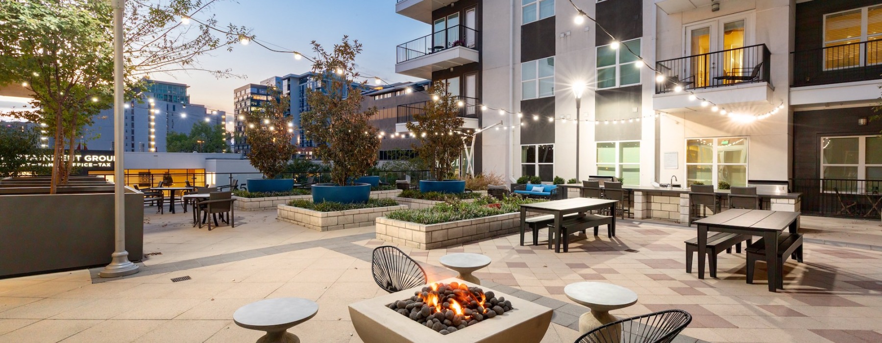 a courtyard with tables and chairs