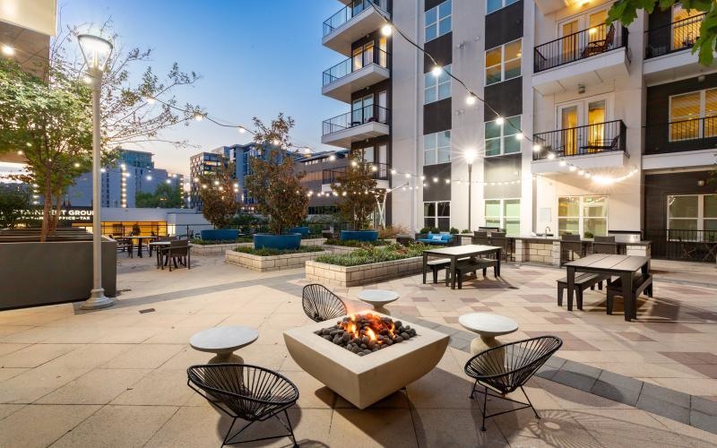 a courtyard with tables and chairs